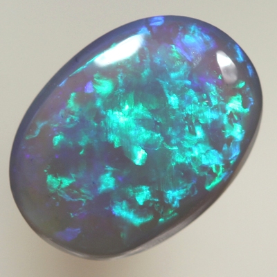 SOLID BLACK CRYSTAL OPAL 8 x 6 mm Crispy bright green over purple